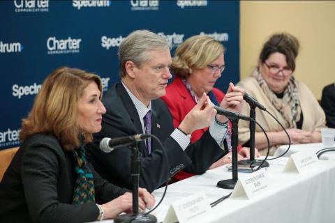Gov Baker and LG at a panel table at event